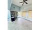Bright living room features tile flooring, a ceiling fan, and lots of natural light from windows at 11714 Peachstone Ln, Orlando, FL 32821