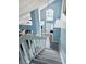 Stylish staircase featuring tile steps and railing, leading to the upper level at 11714 Peachstone Ln, Orlando, FL 32821