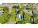 Aerial view of home, lawn, pool, and surrounding neighborhood at 1201 Manchester Rd, Maitland, FL 32751