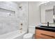 Bathroom showcasing a tub, shower, and contemporary vanity with a black sink at 1201 Manchester Rd, Maitland, FL 32751