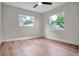 Bright, empty bedroom with hardwood floors and dual windows offering ample natural light at 1201 Manchester Rd, Maitland, FL 32751