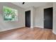 Bedroom featuring hardwood floors and modern black doors and trim at 1201 Manchester Rd, Maitland, FL 32751