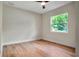 Empty bedroom with hardwood floors and large windows offering natural light at 1201 Manchester Rd, Maitland, FL 32751