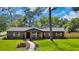 Beautifully renovated home with a landscaped front yard and inviting walkway to the front door at 1201 Manchester Rd, Maitland, FL 32751