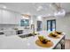 Kitchen island with pendant lights, quartz countertops, and views of the backyard pool at 1201 Manchester Rd, Maitland, FL 32751