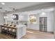 Modern kitchen featuring stainless steel appliances, white cabinets, and a spacious island with seating at 1201 Manchester Rd, Maitland, FL 32751