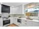 Bright, updated kitchen featuring stainless steel appliances and white marble backsplash at 1201 Manchester Rd, Maitland, FL 32751