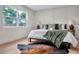 Main bedroom featuring paneled wall and a large window overlooking the yard at 1201 Manchester Rd, Maitland, FL 32751