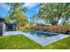 Backyard pool and patio area perfect for relaxing and entertaining guests in a private setting at 1201 Manchester Rd, Maitland, FL 32751