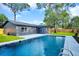 Beautiful backyard with a sparkling pool and well-maintained lawn at 1201 Manchester Rd, Maitland, FL 32751