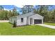 Charming single-story home featuring modern design, complemented by a well-maintained front yard at 13101 Sw 85 Pl, Dunnellon, FL 34432