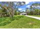 Charming single-story home with a well-manicured lawn and long driveway at 13101 Sw 85 Pl, Dunnellon, FL 34432