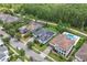 Aerial shot showcasing houses, solar panels, and a lush tree line bordering the community at 13137 Lower Harden Ave, Orlando, FL 32827