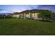 A beautifully manicured backyard with a covered patio for outdoor relaxation and entertaining guests at 13137 Lower Harden Ave, Orlando, FL 32827