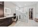 Modern bathroom featuring dual shower heads, sleek fixtures, and a walk-in closet at 13137 Lower Harden Ave, Orlando, FL 32827