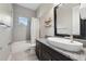 Modern bathroom with granite countertop, vessel sink, and tiled shower at 13137 Lower Harden Ave, Orlando, FL 32827