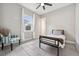 Cozy bedroom with a minimalist bed frame, chair, and bright window at 13137 Lower Harden Ave, Orlando, FL 32827