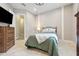 Comfortable bedroom with a large bed, dresser, and neutral tones at 13137 Lower Harden Ave, Orlando, FL 32827