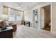 Bonus room with tile floors, comfortable sofa, and piano at 13137 Lower Harden Ave, Orlando, FL 32827
