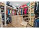 Spacious walk-in closet with custom shelving, drawers, and ample storage space at 13137 Lower Harden Ave, Orlando, FL 32827