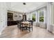 Bright dining room with a large table, tiled floors, and windows offering natural light and greenery views at 13137 Lower Harden Ave, Orlando, FL 32827