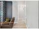 Hallway with tile floors and gray accent wall at 13137 Lower Harden Ave, Orlando, FL 32827