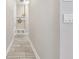 Hallway with bench and coat rack, offering a welcoming and organized entrance to the home at 13137 Lower Harden Ave, Orlando, FL 32827