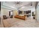 Spacious living room featuring modern furnishings, tile floors, and an open layout to the kitchen at 13137 Lower Harden Ave, Orlando, FL 32827