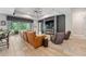 Inviting living room featuring a fireplace, comfortable seating, and views of the outdoors at 13137 Lower Harden Ave, Orlando, FL 32827