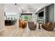 Bright, open-concept living room featuring a modern fireplace and seamless access to the outdoors at 13137 Lower Harden Ave, Orlando, FL 32827
