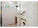 Shower with large shower heads, tile surround, and pebble floor at 13137 Lower Harden Ave, Orlando, FL 32827