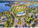 Aerial view of a community showcasing the community pool, manicured landscaping, and nearby lakes, highlighting the location at 14285 United Colonies Dr, Winter Garden, FL 34787
