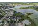 A beautiful aerial community shot with homes, a pond, and well manicured green spaces at 14285 United Colonies Dr, Winter Garden, FL 34787