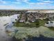 Aerial view of a neighborhood highlighting waterfront properties and lush landscaping near a lake at 14285 United Colonies Dr, Winter Garden, FL 34787