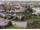 A neighborhood aerial view shows beautiful homes with lush landscaping and lake views at 14285 United Colonies Dr, Winter Garden, FL 34787