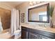 Bathroom with granite vanity top, shower and tiled tub, and neutral color palette at 14285 United Colonies Dr, Winter Garden, FL 34787