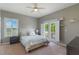Relaxing bedroom with water views, shutters, and access to a private balcony at 14285 United Colonies Dr, Winter Garden, FL 34787