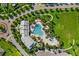 Aerial view of the community pool, clubhouse, playground and surrounding landscaping at 14285 United Colonies Dr, Winter Garden, FL 34787