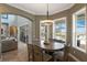 Cozy dining room with a view of the pool and outdoor area, enhanced by natural lighting at 14285 United Colonies Dr, Winter Garden, FL 34787