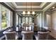 Spacious dining area with a large wood table, pendant lighting, and views into the adjacent living spaces at 14285 United Colonies Dr, Winter Garden, FL 34787