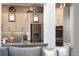 Modern kitchen with stainless steel appliances, pendant lighting, stone backsplash, and granite countertops at 14285 United Colonies Dr, Winter Garden, FL 34787