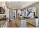 Spacious kitchen with stainless steel appliances, an island, granite counters, and an open layout to the living area at 14285 United Colonies Dr, Winter Garden, FL 34787
