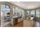 Gourmet kitchen open to the living area, featuring stainless appliances, granite counters, and bright lighting at 14285 United Colonies Dr, Winter Garden, FL 34787