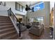 Open-concept living room with staircase, high ceilings, and sliding doors to an outdoor patio area at 14285 United Colonies Dr, Winter Garden, FL 34787