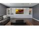 Cozy living room with modern built-ins, shelving, and a dark wood floor at 14285 United Colonies Dr, Winter Garden, FL 34787