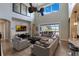 Large living room with a white brick accent wall, fireplace, and views of the patio at 14285 United Colonies Dr, Winter Garden, FL 34787