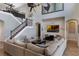 Spacious living room with high ceilings, ceiling fan, and white brick fireplace with large TV at 14285 United Colonies Dr, Winter Garden, FL 34787