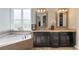 The main bathroom features double sinks, a garden tub, and updated fixtures at 14285 United Colonies Dr, Winter Garden, FL 34787