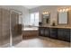 The main bathroom features double sinks, a garden tub, and a glass enclosed shower at 14285 United Colonies Dr, Winter Garden, FL 34787