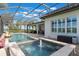 Outdoor screened pool area with a tranquil spa, fountain, and a covered patio, ideal for outdoor living at 14285 United Colonies Dr, Winter Garden, FL 34787